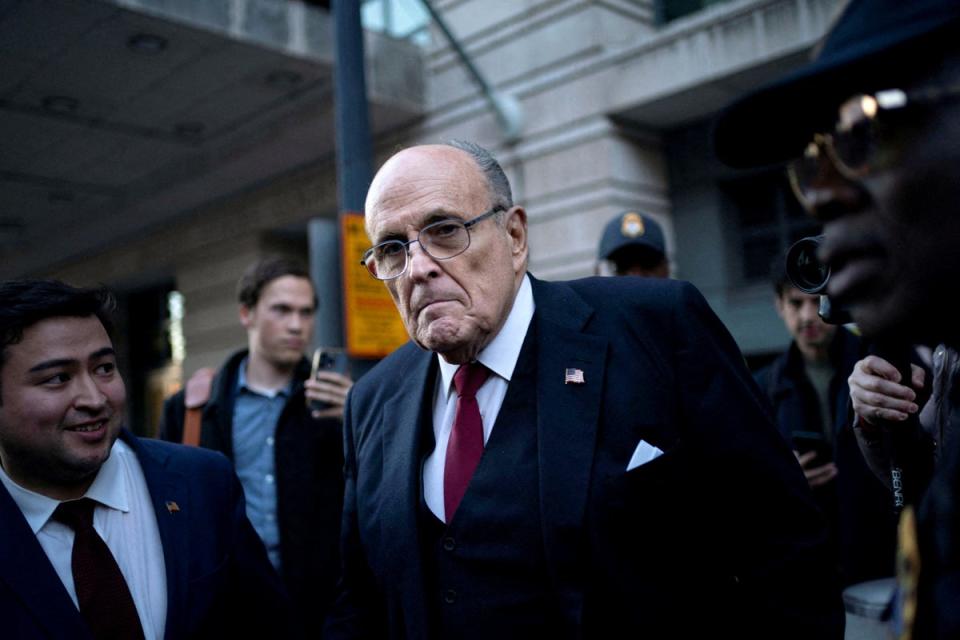 Former New York Mayor Rudy Giuliani departs the US District Courthouse after he was ordered to pay $148m in his defamation case in Washington on December 15 2023 (REUTERS)