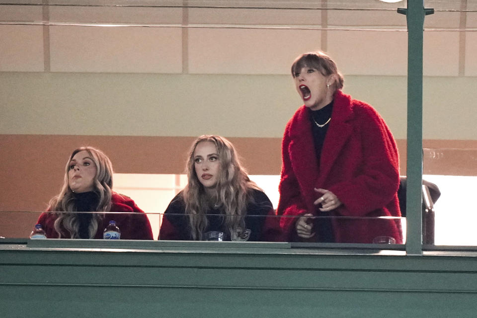 Taylor Swift, right, reacts during the second half of an NFL football game between the Kansas City Chiefs and Green Bay Packers, Sunday, Dec. 3, 2023 in Green Bay, Wis. (AP Photo/Morry Gash)