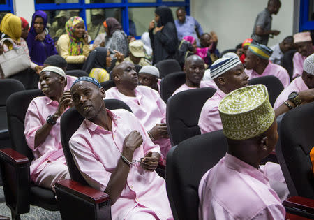 Unidentified suspects are seen inside the Rwandan high court after being convicted of belonging to extremist groups including al Shabaab and Islamic State and providing them support, in Nyanza, Rwanda March 22, 2019. REUTERS/Jean Bizimana