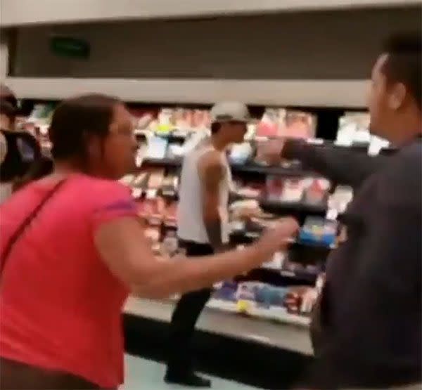 The men yell at each other in the meat aisle of Woolworths. Photo: 7 News