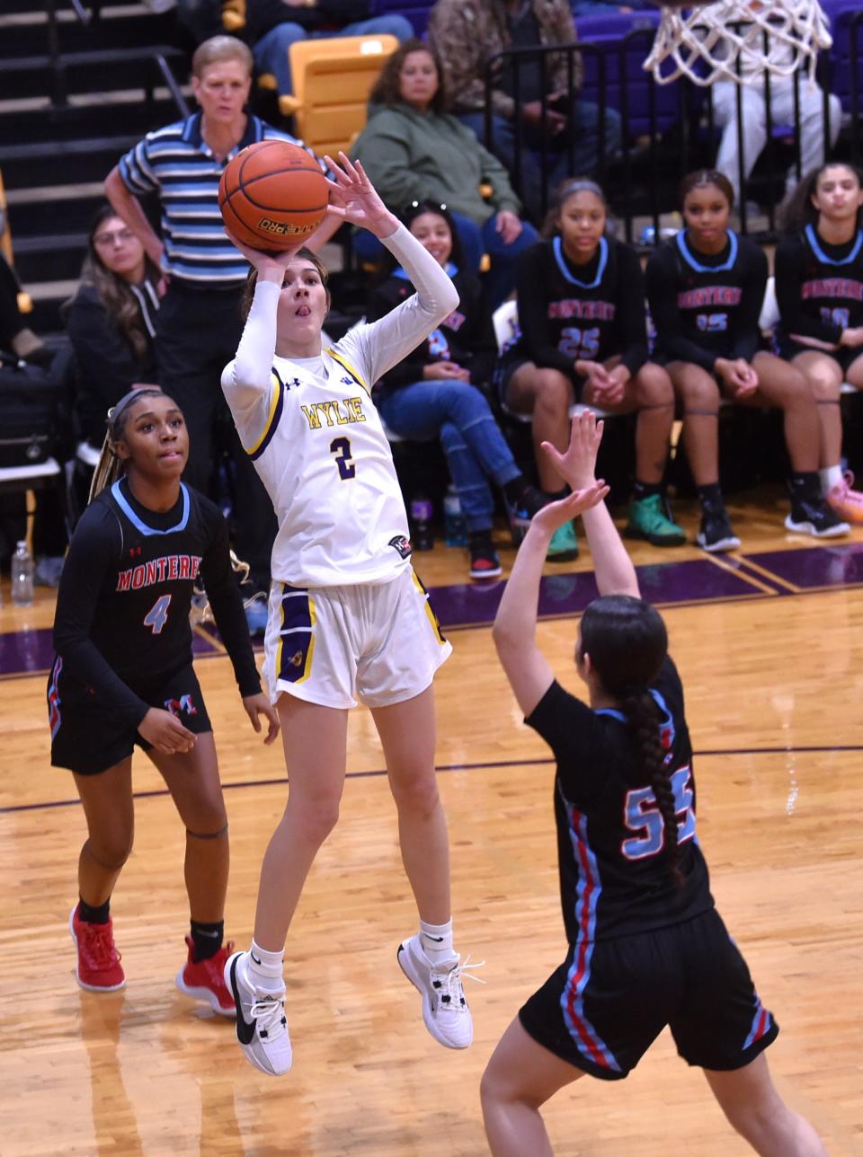 Abilene Wylie's Kyla Kelley (2) shoots over Lubbock Monterey's Jasmine Holloway in the first half. Monterey beat the Lady Bulldogs 58-43 in a District 4-5A game Tuesday, Jan. 2, 2024, at Bulldog Gym.