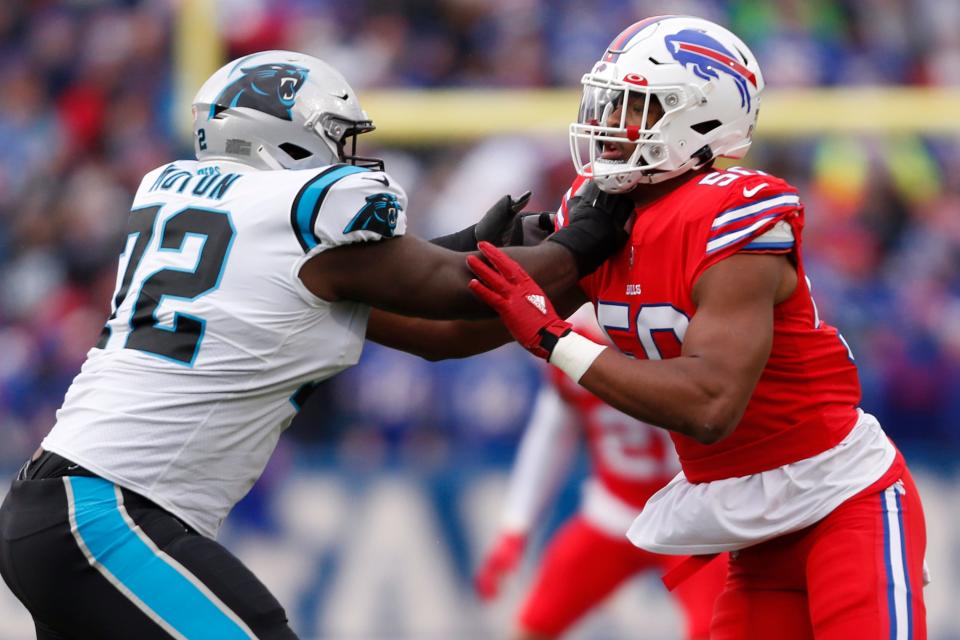 Carolina Panthers offensive tackle Taylor Moton (72) and Buffalo Bills defensive end Greg Rousseau (50) battle on the line during the first half of an NFL football game in Orchard Park, N.Y., Sunday, Dec. 19, 2021.