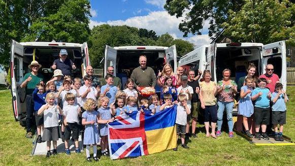 Simon Reevell and pupils from Beswick and Watton School