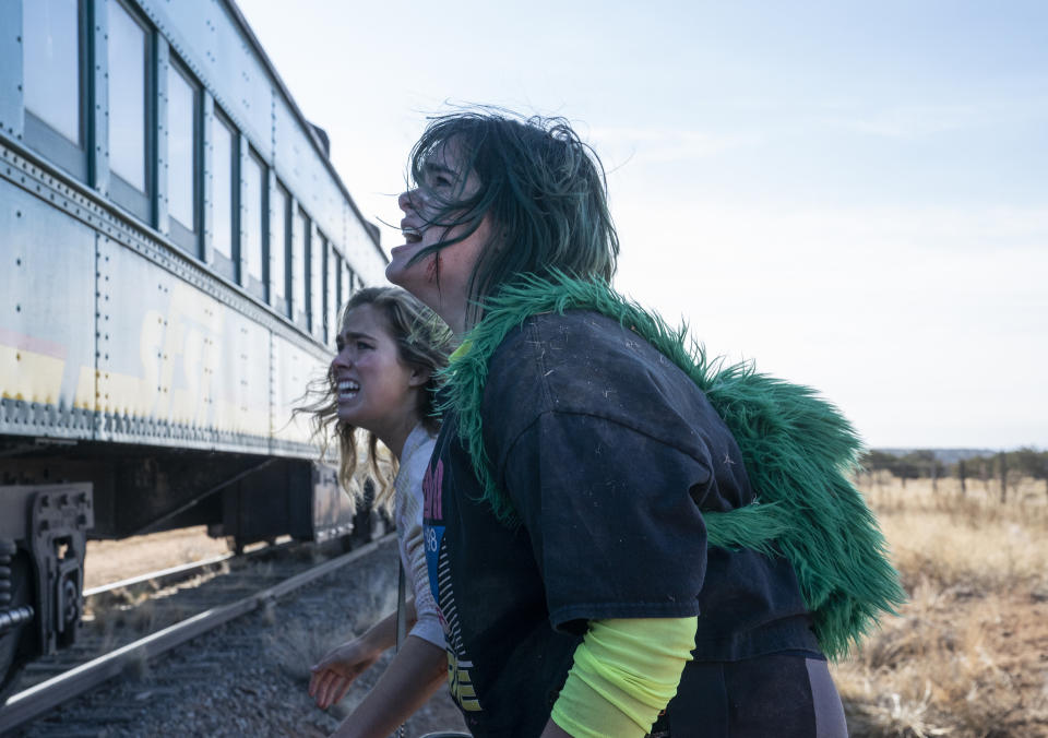 This image released by HBO Max shows Haley Lu Richardson, left, and Barbie Ferreira in a scene from "Unpregnant." (Ursula Coyote/HBO Max via AP)