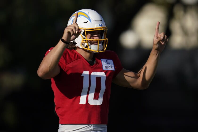 Los Angeles Chargers quarterback Justin Herbert (10) participates in drills.