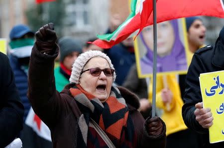 An opponent of Iranian President Hassan Rouhani chants slogans during a protest outside the European Union Council in Brussels, Belgium January 3, 2018. REUTERS/Francois Lenoir