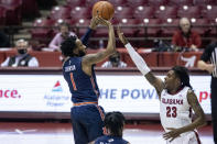 Auburn guard Jamal Johnson (1) shoots a jumper over Alabama guard John Petty Jr. (23) during the first half of an NCAA college basketball game Tuesday, March 2, 2021, in Tuscaloosa, Ala. (AP Photo/Vasha Hunt)