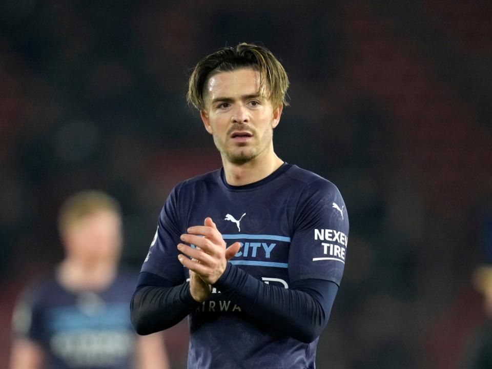 Jack Grealish applauds the travelling Man City fans  (AP)