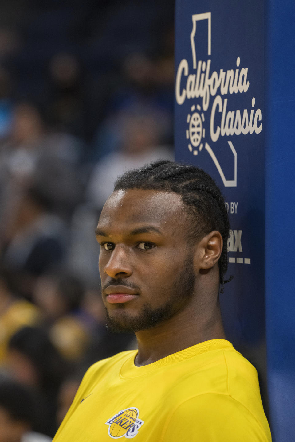 Los Angeles Lakers guard Bronny James watches warmup action before an NBA summer league basketball game against Golden State Warriors in San Francisco , Sunday, July 7, 2024. (AP Photo/Nic Coury)