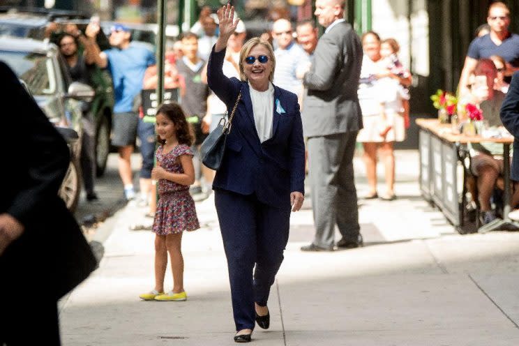 Hillary Clinton waves after leaving an apartment building Sunday, Sept. 11, 2016, in New York. ( Photo: Andrew Harnik/AP)