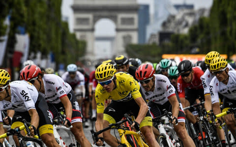 Chris Froome wearing the overall leader's yellow jersey - Credit: AFP