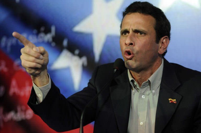 Venezuelan opposition leader Henrique Capriles speaks during a press conference in Caracas on March 10, 2013. The campaign to succeed the late Hugo Chavez in Venezuela has officially begun and so has the mudslinging, good and thick