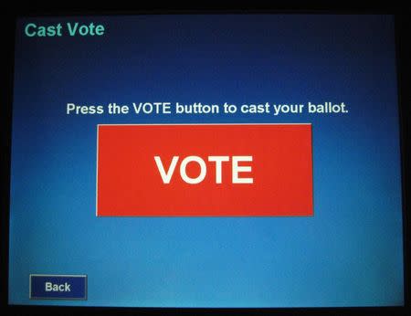 A Touch Screen Voting Machine displays the final button to complete casting a ballot at a "In-Person Absentee Voting" location at McLean Governmental Center in McLean, Virginia, U.S. on October 25, 2008. REUTERS/Hyungwon Kang/File Photo