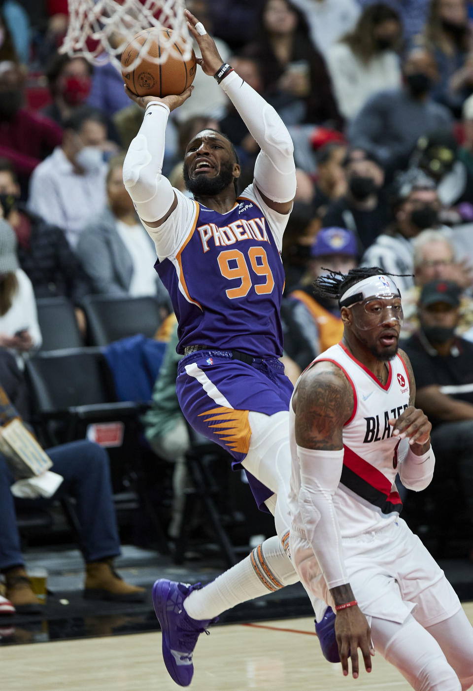 Phoenix Suns forward Jae Crowder, left, shoots over Portland Trail Blazers forward Robert Covington during the second half of an NBA basketball game in Portland, Ore., Saturday, Oct. 23, 2021. (AP Photo/Craig Mitchelldyer)