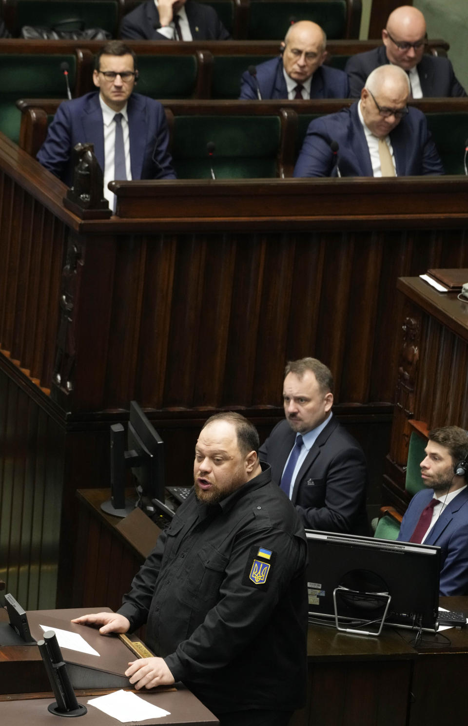 The chairman of the Ukrainian parliament, Ruslan Stefanchuk, front, speaks to Poland's lawmakers in Poland's parliament in Warsaw, Poland, Thursday, 25 May 2023 to thank Poland for military and humanitarian support for Ukraine fighting Russia's aggression and also encouraging reconciliation over painful mutual World War II history marked by mass murders. (AP Photo/Czarek Sokolowski)