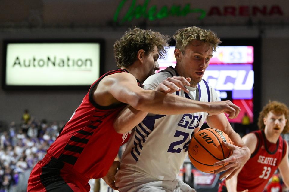 Duke Brennan (24) of the Grand Canyon Antelopes tries to drive around Brandton Chatfield (25) of the Seattle Redhawks in the second half of the semifinal game of the Western Athletic Conference basketball tournament at the Orleans Arena on March 15, 2024 in Las Vegas. The Antelopes defeated the Redhawks 80-72.