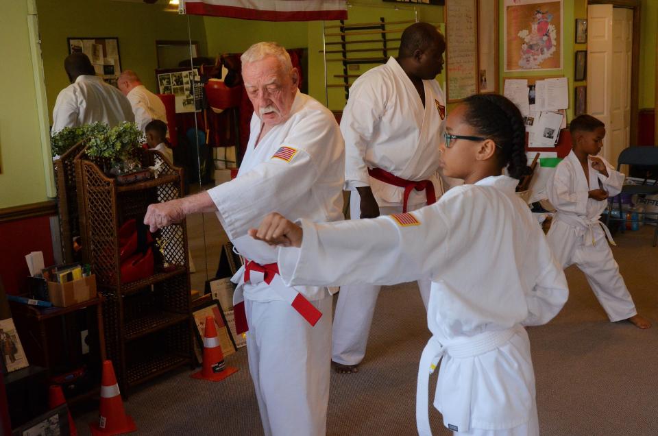Antonio Montalvo works on his kata, or karate movements, with Sensei Ray Clark at the New Bern School of Martial Arts.