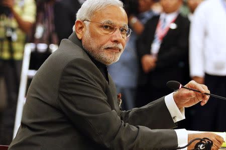 Indian Prime Minister Narendra Modi attends the 12th ASEAN-India Summit during the 25th ASEAN Summit in Myanmar International Convention Centre in Naypyitaw November 12, 2014. REUTERS/Soe Zeya Tun/Files