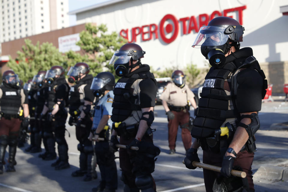 FILE - In this May 28, 2020, file photo, Minnesota State Police protect a Target Store Thursday,, in St. Paul, Minn. The Minnesota State Patrol purged e-mails and texts messages immediately after their response to protests in the wake of George Floyd’s death last summer, according to court testimony in a lawsuit that alleges the State Patrol targeted journalists during the unrest. (AP Photo/John Minchillo)