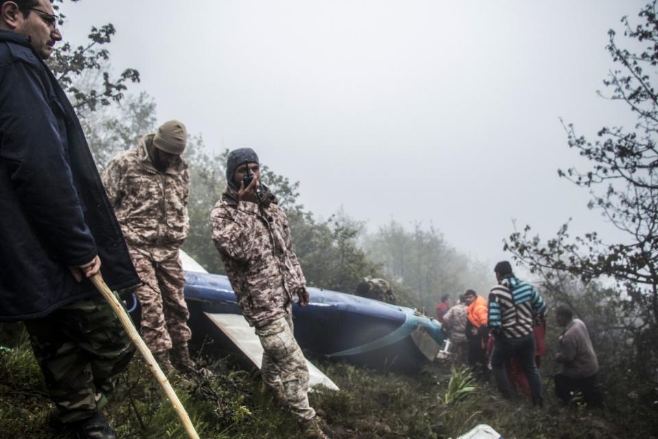 <span>Rescue team members work at the crash site of a helicopter carrying Iranian President Ebrahim Raisi in Varzaghan, northwestern Iran on May 20, 2024</span><div><span>Azin HAGHIGHI</span><span>MOJ News Agency</span></div>