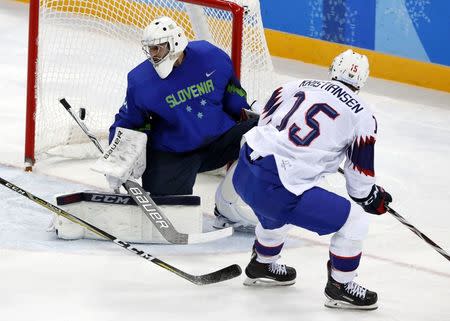 Ice Hockey - Pyeongchang 2018 Winter Olympics - Men's Playoff Match - Slovenia v Norway - Gangneung Hockey Centre, Gangneung, South Korea - February 20, 2018 - Tommy Kristiansen of Norway scores a goal against goalkeeper Gasper Kroselj of Slovenia. REUTERS/Grigory Dukor