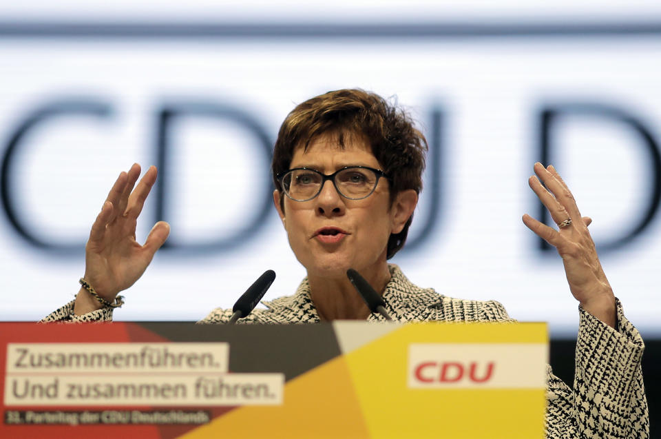 CDU General Secretary Annegret Kramp-Karrenbauer delivers her speech when running as chairwoman at the party convention of the Christian Democratic Party CDU in Hamburg, Germany, Friday, Dec. 7, 2018. 1001 delegates are electing a successor of German Chancellor Angela Merkel who doesn't run again for party chairmanship after more than 18 years at the helm of the party. (AP Photo/Markus Schreiber)