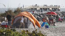 <p>Visitors stake out spots near the fishing pier at Jetty Park and Cocoa Beach to watch SpaceX’s first Falcon Heavy rocket launch from the Kennedy Space Center, Fla., Feb. 5, 2018. (Photo: Gregg Newton/Reuters) </p>