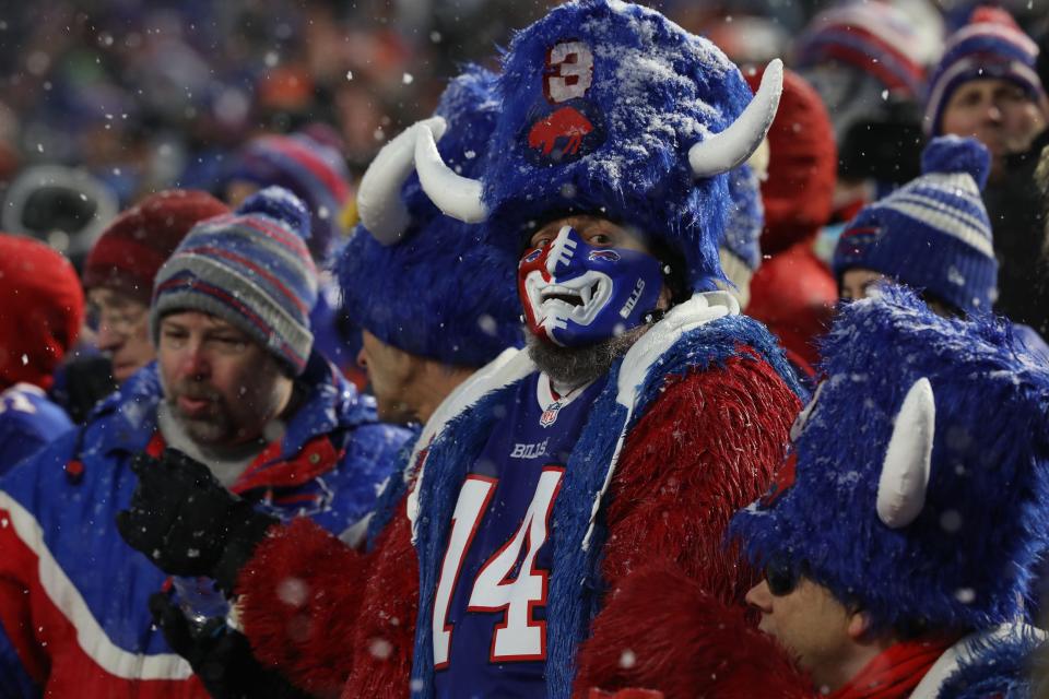 A Bills fans is decked out in a players shirt and Buffalo hat during second half of the playoff loss to the Bengals.