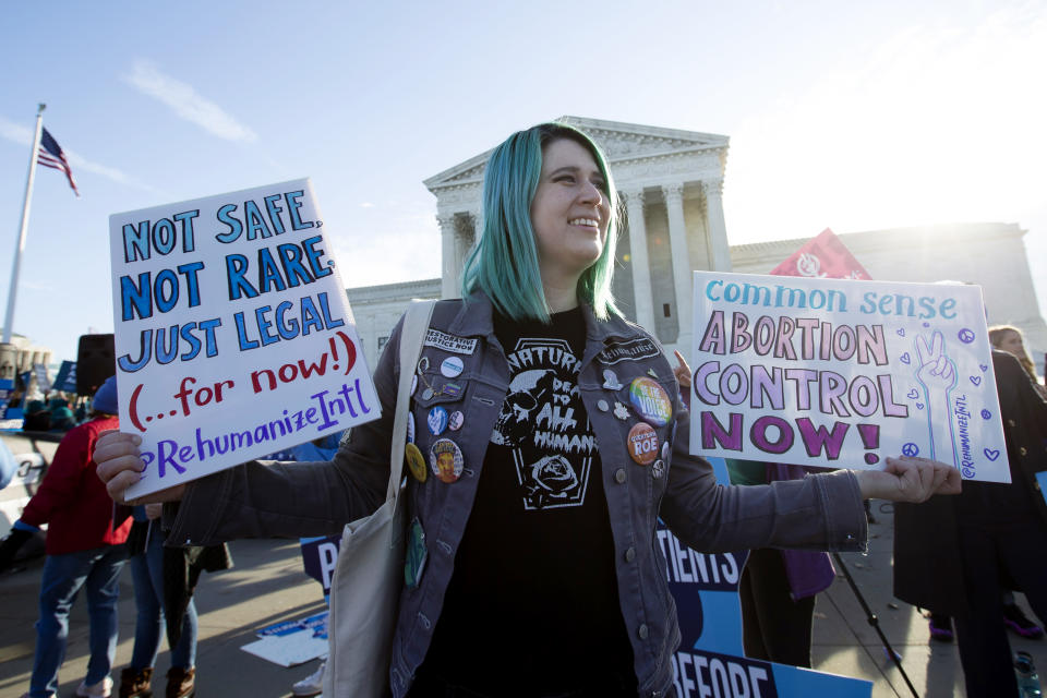 Abortion rights demonstrators rally outside of the U.S. Supreme Court in Washington, Wednesday, March 4, 2020. The Supreme Court is taking up the first major abortion case of the Trump era Wednesday, an election-year look at a Louisiana dispute that could reveal how willing the more conservative court is to roll back abortion rights. (AP Photo/Jose Luis Magana)