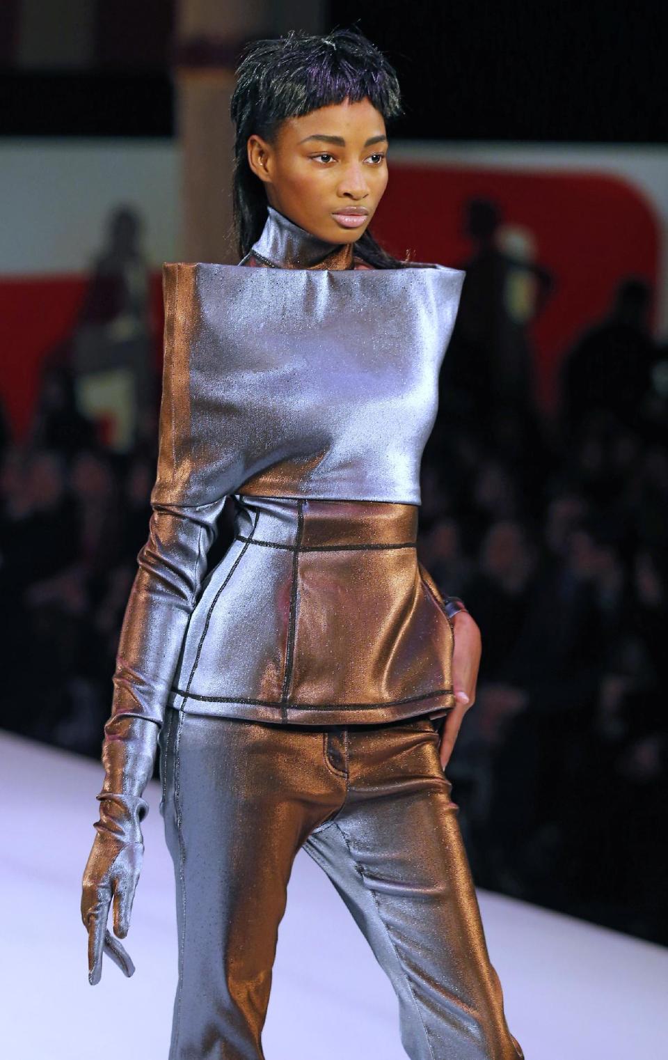 A model wears a creation by French fashion designer Jean-Paul Gaultier as part of his Ready to Wear Fall-Winter 2013-2014 fashion collection, presented, Saturday, March 2, 2013 in Paris. (AP Photo/Jacques Brinon)