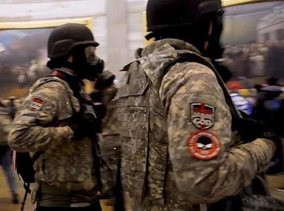 Patches stating “full armor of God” were seen on the sleeves of some people who were part of the incursion into the U.S. Capitol on Jan. 6, 2021, in Washington, D.C. Frame grab from Insider News video