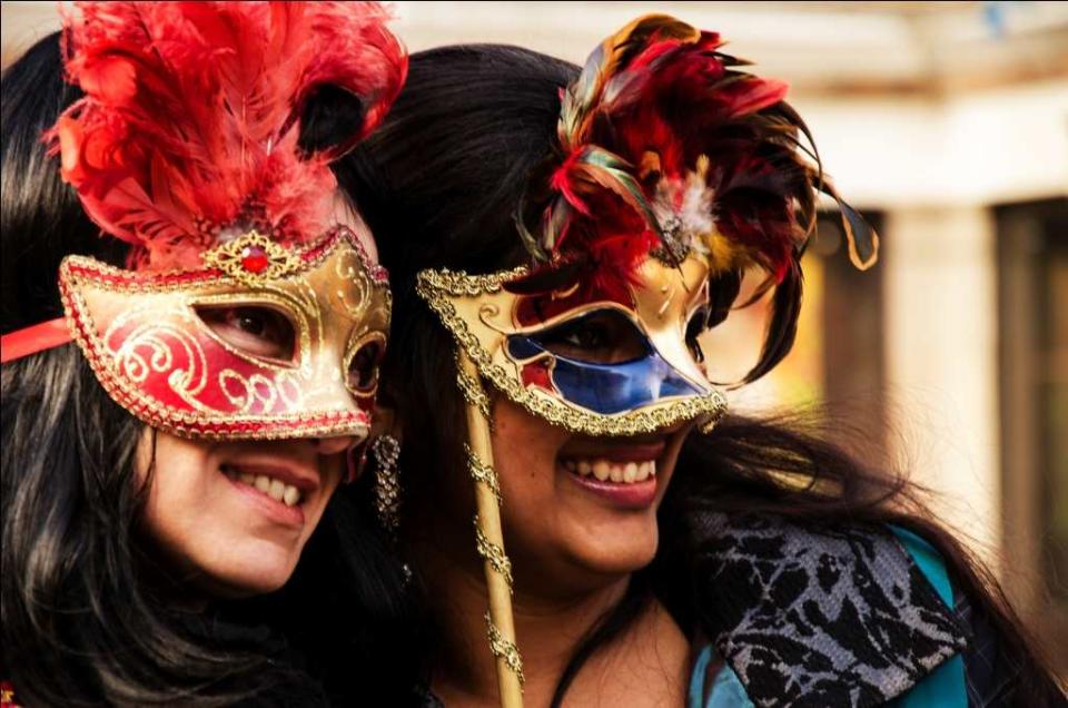 Tourists enjoy the Carnival in Venice. Venice can be very touristy and restaurants with signboards such as ‘Menu Turistico’ are to be avoided.