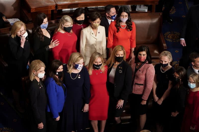 FILE PHOTO: Members of the House of Representatives gather for oath of office during the first session of the 117th Congress in Washington