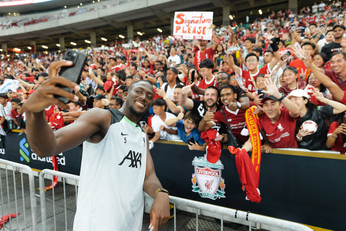 Liverpool defender Ibrahima Konate takes selfies with fans during the club's open training session at the National Stadium. (PHOTO: Singapore Festival of Football Driven by CDG Zig)