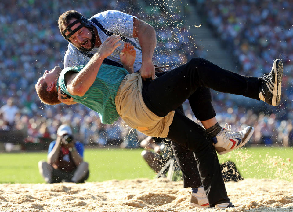 Swiss Alpine wrestlers Gisler and Sempach fight during the Federal Alpine Wrestling Festival