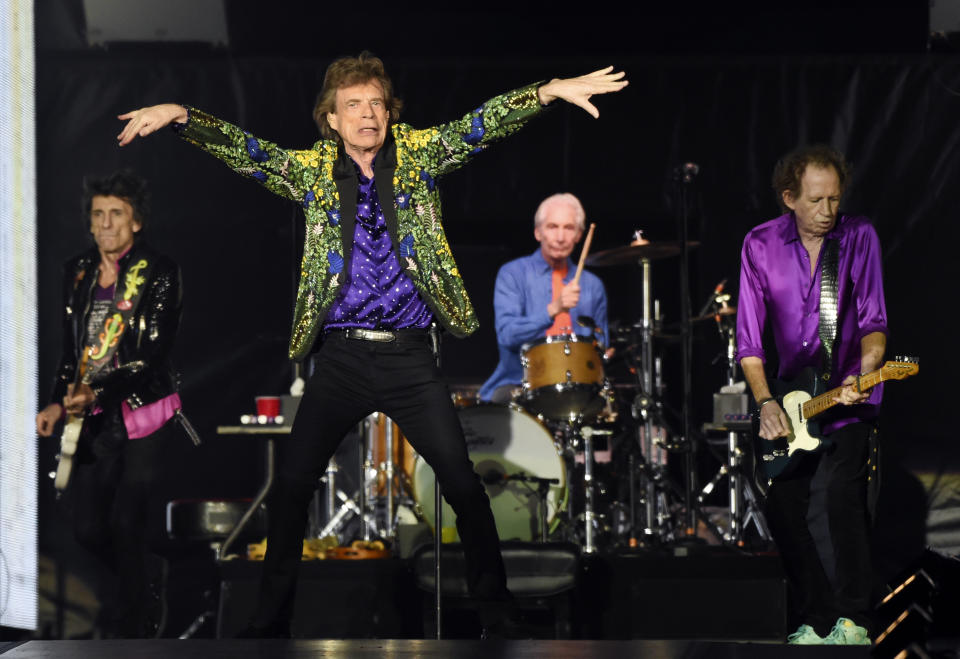 FILE - Ron Wood, from left, Mick Jagger, Charlie Watts and Keith Richards of the Rolling Stones perform during their concert in Pasadena, Calif. The Rolling Stones are releasing a new version of their 1973 album “Goats Head Soup” with three unheard tracks. One of the new tracks is called “Scarlet” and features Led Zeppelin guitarist Jimmy Page. The album coming out on Sept. 4, 2020 will have a four-disc CD and vinyl box set edition with ten bonus tracks. The Stones also released a video for one of the unheard songs, called “Criss Cross.” (Photo by Chris Pizzello/Invision/AP, File)