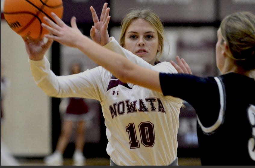Tia Tanner of Nowata High looks to make a pass during playoff action on Feb. 18, 2023.