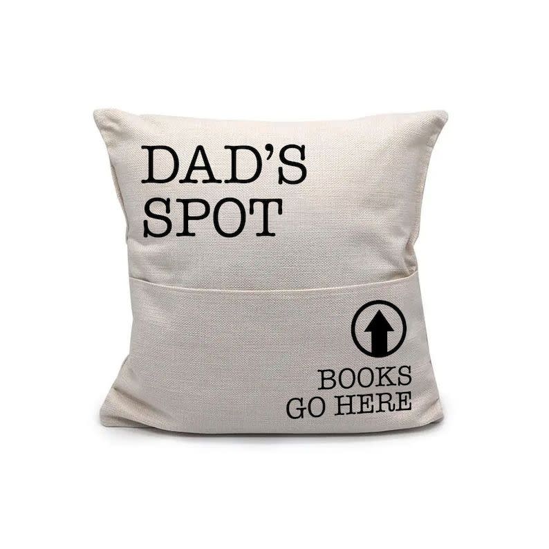 <p><strong>zoeysattic</strong></p><p>etsy.com</p><p><strong>$25.20</strong></p><p>Every dad has their favorite spot on the couch and this pillow will let everyone know. He can put the remote, his eyeglasses or movie snacks in the front pouch for safekeeping. </p>