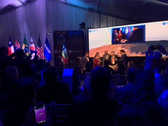 Chilean President Michelle Bachelet hits a rock with a hammer at the groundbreaking ceremony for the Giant Magellan Telescope at Las Campanas Observatory on Nov. 11. ("Las Campanas" means "the bells" in Spanish; the observatory was named after