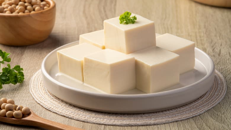 sliced tofu stacked on plate