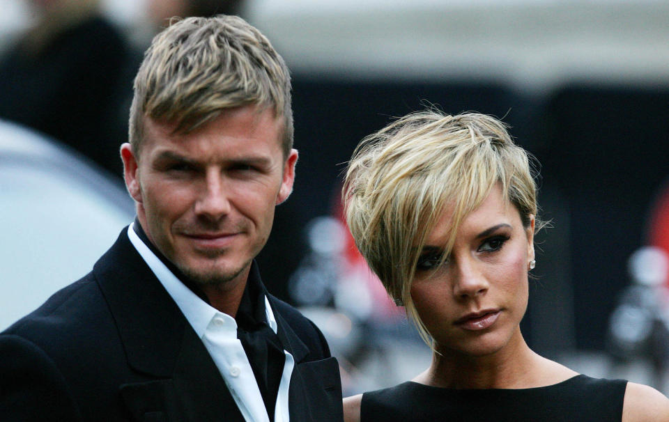 David Beckham and his wife Victoria arrive for the Sports Industry awards in London, 29 March 2007. (Carl De Souza / AFP via Getty Images)