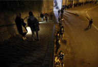 Students line up for free food aid organized by Linkee, a Paris-based company collecting food waste, in Paris, Monday, Feb. 1, 2021. A quarter of French young professionals can't find work, and many university students are standing in food lines or calling hotlines for psychological help. They are France's future, and their plight is central to the country's battle to emerge from the pandemic. (AP Photo/Christophe Ena)