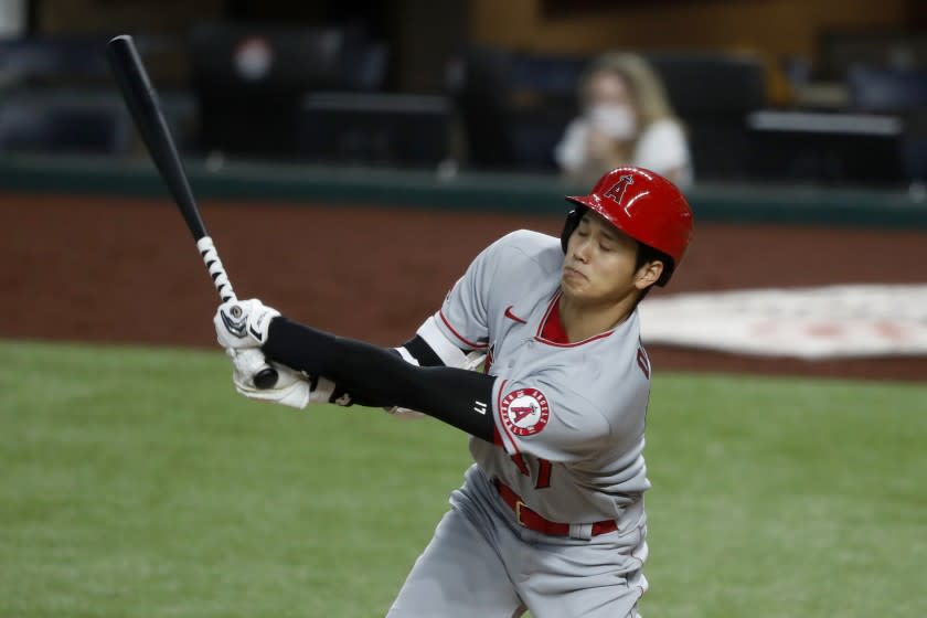 Los Angeles Angels' Shohei Ohtani swings at a pitch from Texas Rangers' Edinson Volquez in the sixth inning of a baseball game in Arlington, Texas, Saturday, Aug. 8, 2020. Ohtani grounded out to first in the at-bat. (AP Photo/Tony Gutierrez)