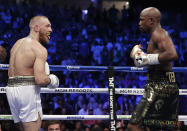 <p>Conor McGregor sticks his tongue out at Floyd Mayweather Jr. in a super welterweight boxing match Saturday, Aug. 26, 2017, in Las Vegas. (AP Photo/Isaac Brekken) </p>