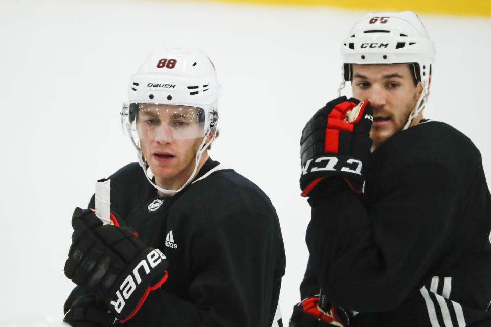 Chicago Blackhawks right wings Patrick Kane (88) and Andrew Shaw (65) attend the first day of training camp held in Chicago, Friday, Sept. 13, 2019. (Jose M. Osorio/Chicago Tribune via AP)