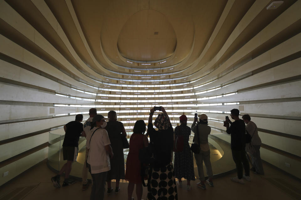 People visit the UK pavilion at the Dubai Expo 2020 in Dubai, United Arab Emirates, Saturday, Oct, 2, 2021. (AP Photo/Kamran Jebreili)