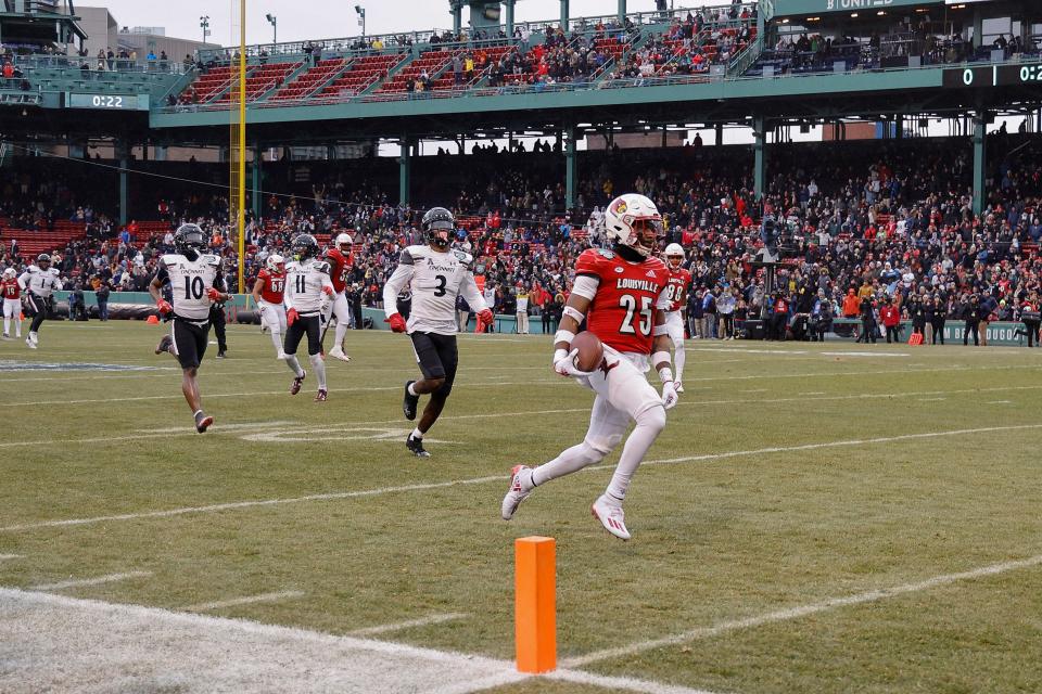 Louisville's Jawhar Jordan runs for a touchdown in the first half of the 2022 Fenway Bowl.