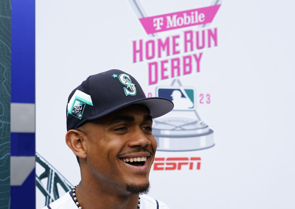 American League's Julio Rodriguez, of the Seattle Mariners, smiles during All-Star Game player availability, Monday, July 10, 2023, in Seattle. The All-Star Game will be played Tuesday, July 11. (AP Photo/Lindsey Wasson)