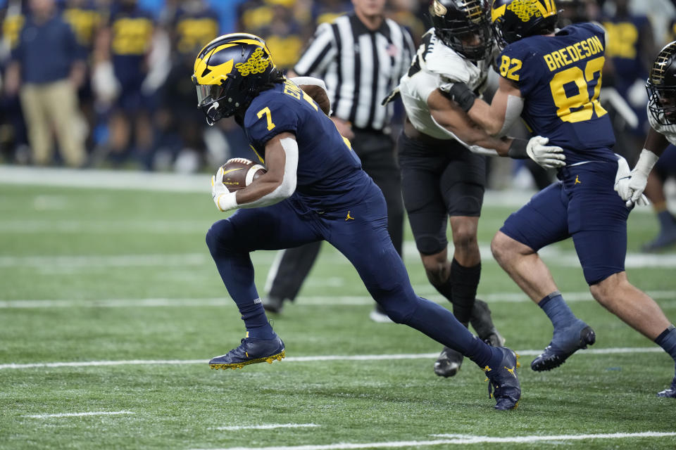 Michigan running back Donovan Edwards runs against Purdue in the Big Ten championship on Saturday, Dec. 3, 2022, in Indianapolis. (AP Photo/Michael Conroy)