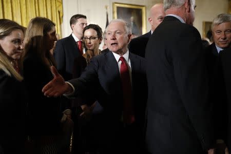 U.S. Attorney General Jeff Sessions greets guests in the White House East Room, where U.S. President Donald Trump discussed administration plans to combat the nation's opioid crisis in Washington, U.S., October 26, 2017. REUTERS/Kevin Lamarque